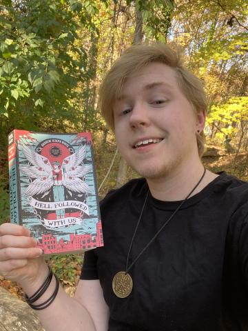Author holding his book