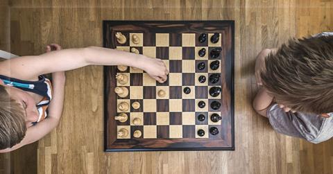 Chess play overhead shot